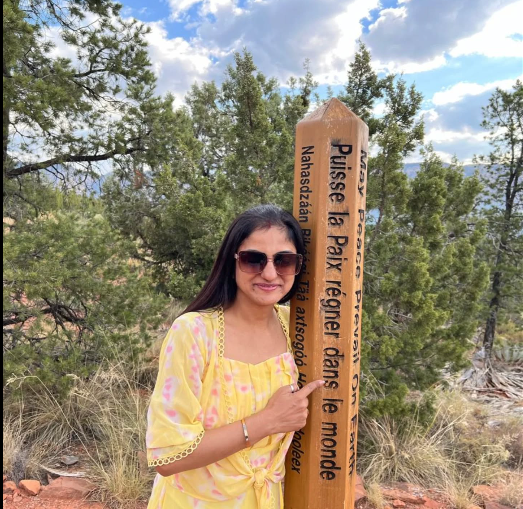 Bhaveshi exploring a French-language park sign